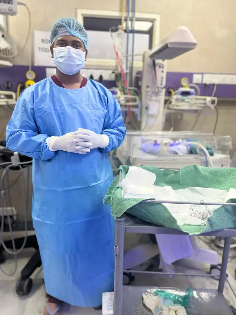 Dr. RMD in full PPE gear inside the Neonatal ICU at RML Hospital